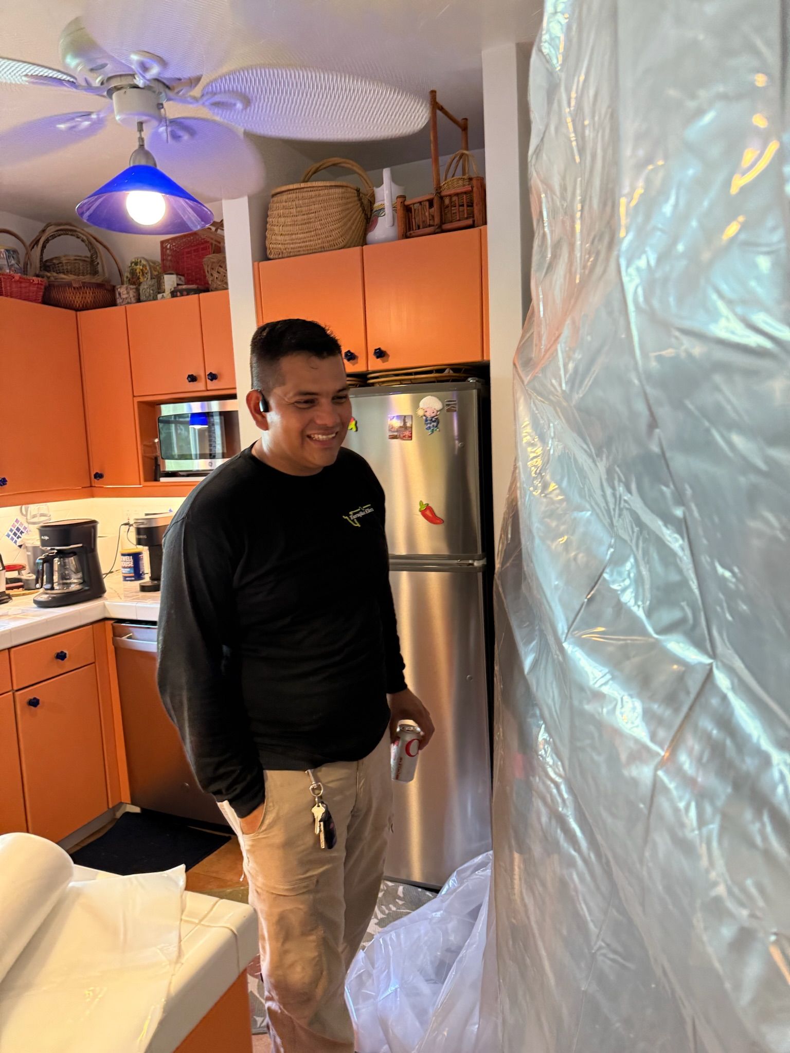 Smiling electrician on a kitchen remodel